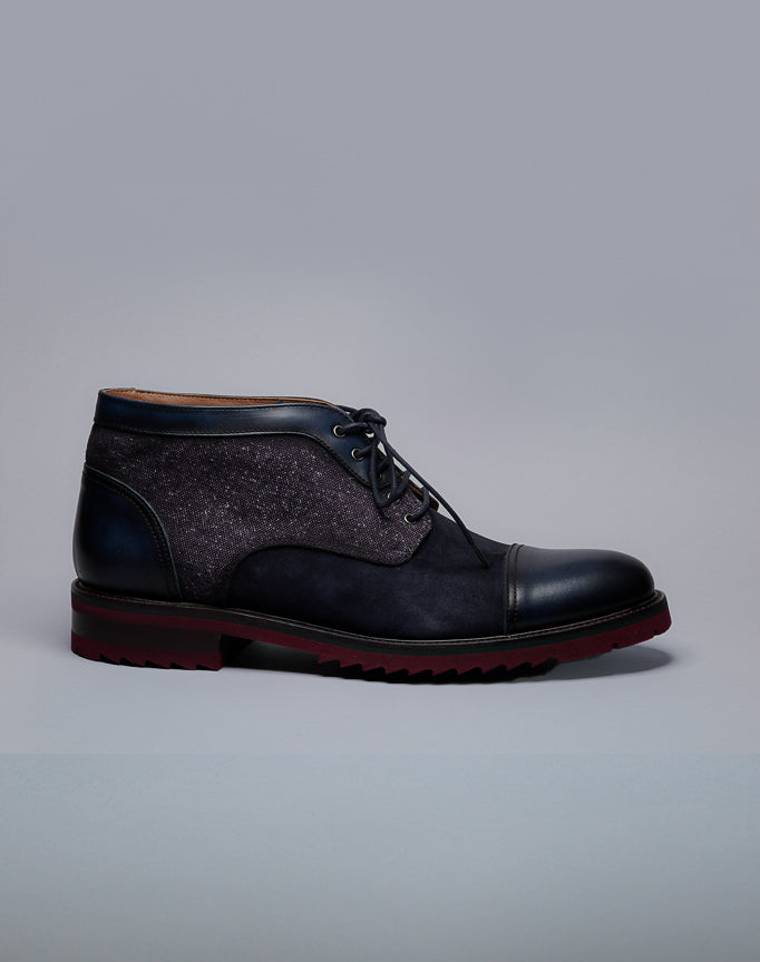 Calce Suede and leather boots with stylish stacked lug sole with laces.