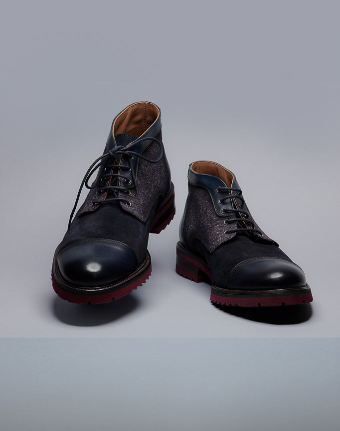 Calce Suede and leather boots with stylish stacked lug sole with laces.